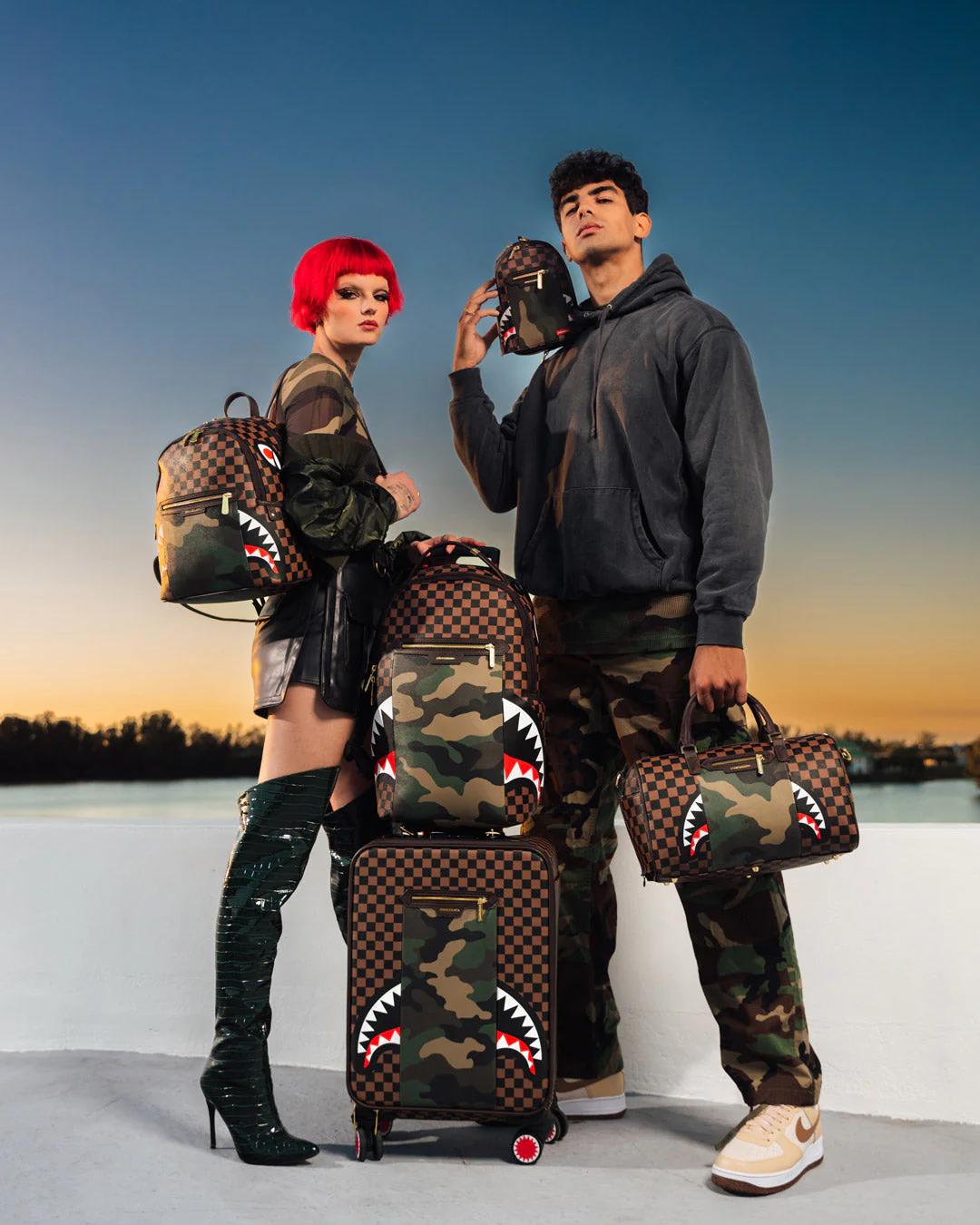 EXTERIOR GOLD ZIP POCKET SHARKS IN PARIS BACKPACK SLING | Sprayground Value