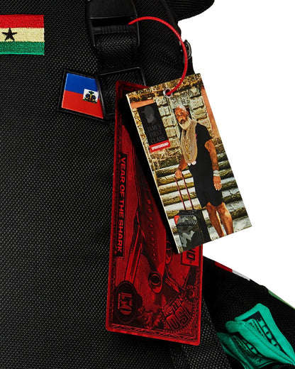 JAMES FIRST CLASS GLOBAL FLAGS MONEYBEAR BACKPACK | Sprayground Value