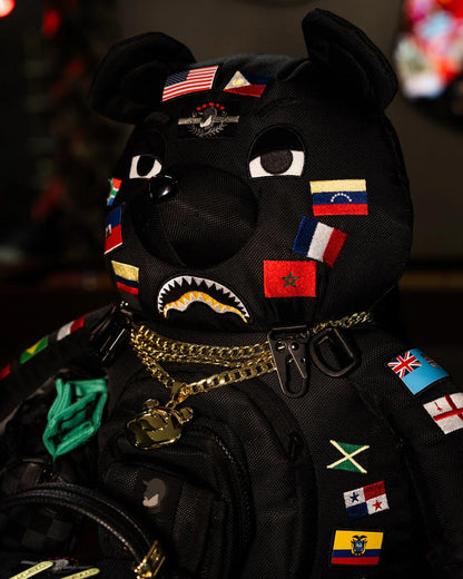 JAMES FIRST CLASS GLOBAL FLAGS MONEYBEAR BACKPACK | Sprayground Value