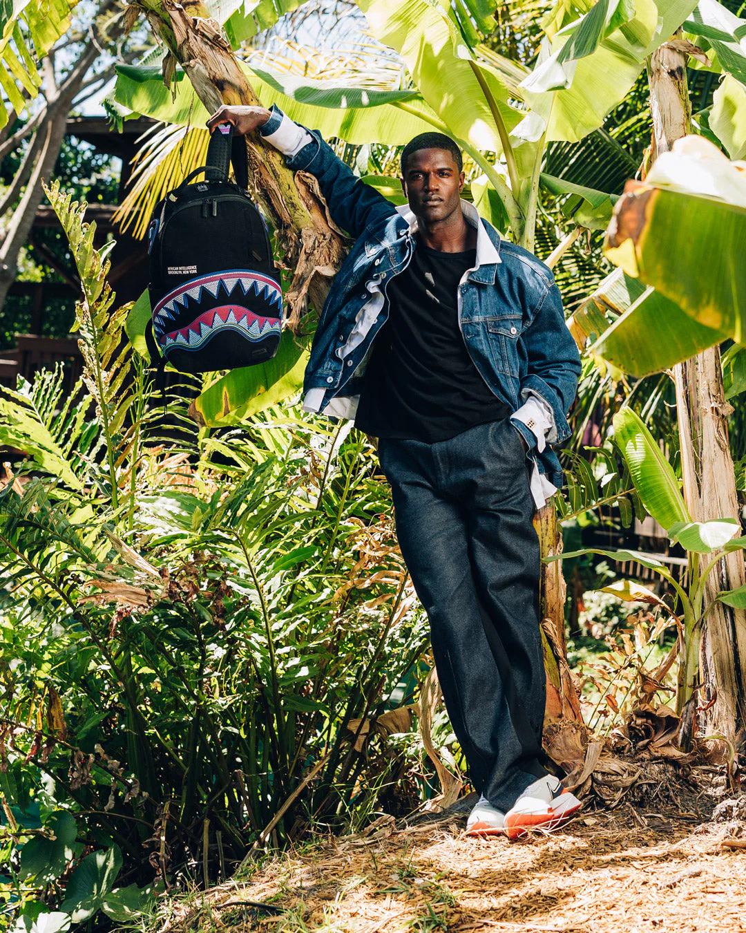 A.I. AFRICAN INTELLIGENCE BORN AND RAISED BACKPACK - SANDFLOWER COLLAB | Sprayground Signature