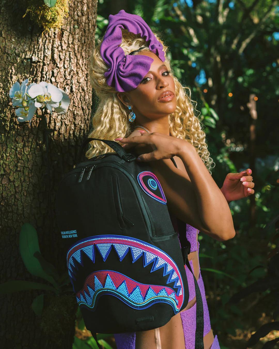 A.I. AFRICAN INTELLIGENCE BORN AND RAISED BACKPACK - SANDFLOWER COLLAB | Sprayground Signature