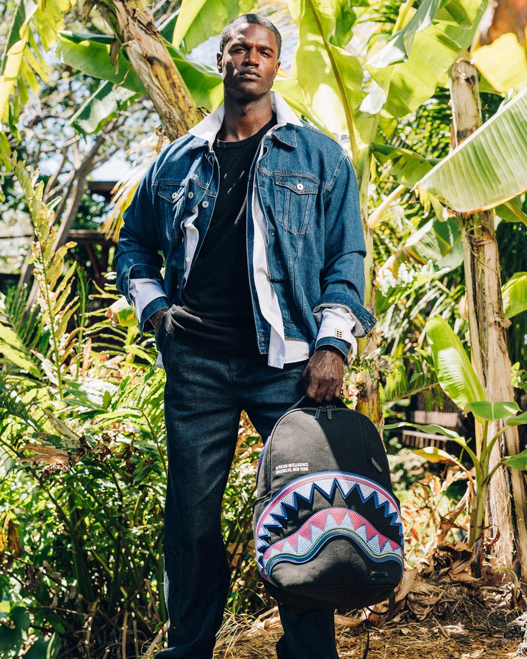 A.I. AFRICAN INTELLIGENCE BORN AND RAISED BACKPACK - SANDFLOWER COLLAB | Sprayground Signature