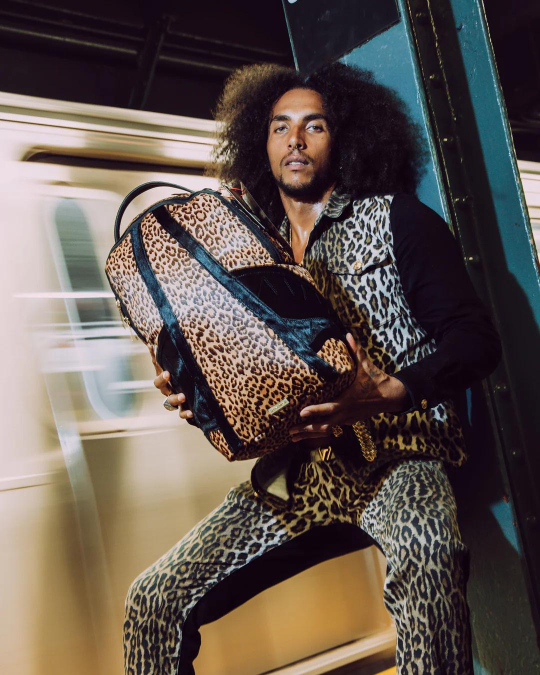 AFRICAN INTELLIGENCE 9 COURAGE LIVES ON BACKPACK - SANDFLOWER COLLAB | Sprayground Quality