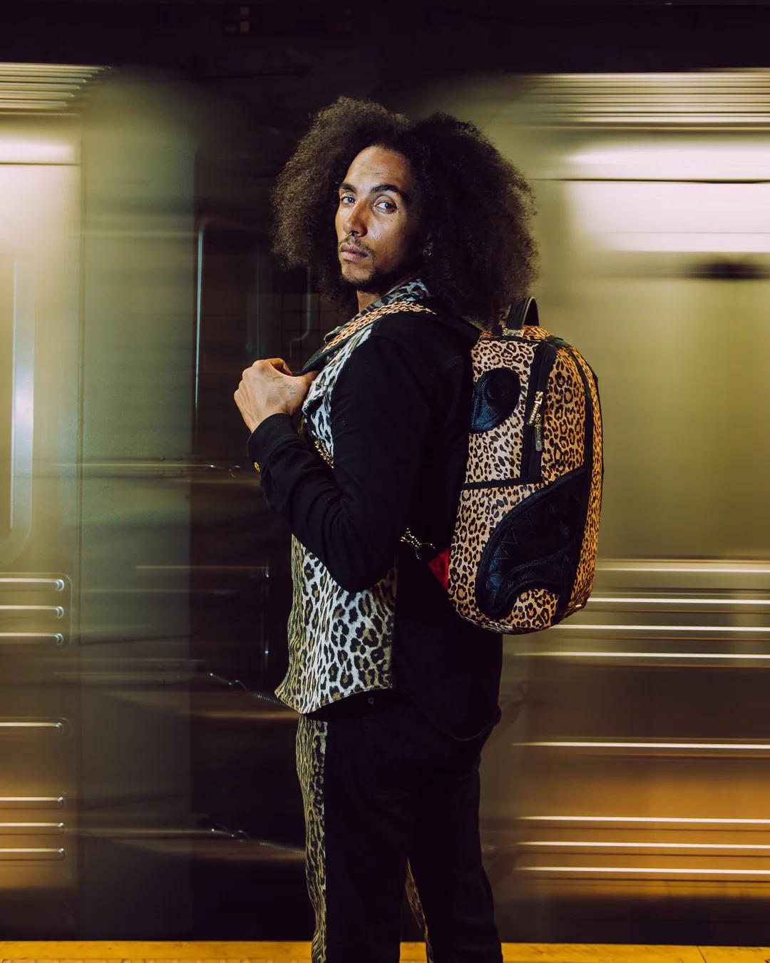 AFRICAN INTELLIGENCE 9 COURAGE LIVES ON BACKPACK - SANDFLOWER COLLAB | Sprayground Quality