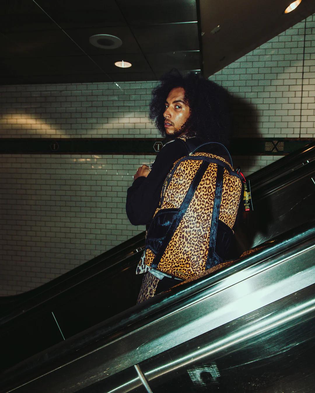 AFRICAN INTELLIGENCE 9 COURAGE LIVES ON BACKPACK - SANDFLOWER COLLAB | Sprayground Quality