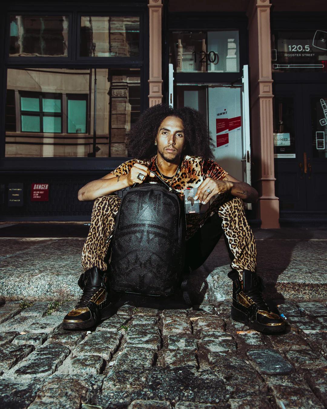 AFRICAN INTELLIGENCE 9 APEX GENIUS BACKPACK - SANDFLOWER COLLAB | Sprayground Premium