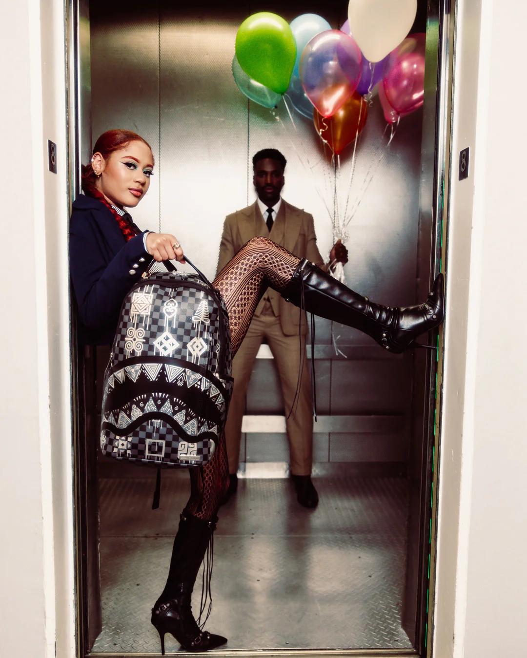 AFRICAN INTELLIGENCE 9 POWER GLYPHICS BACKPACK - SANDFLOWER COLLAB | Sprayground New
