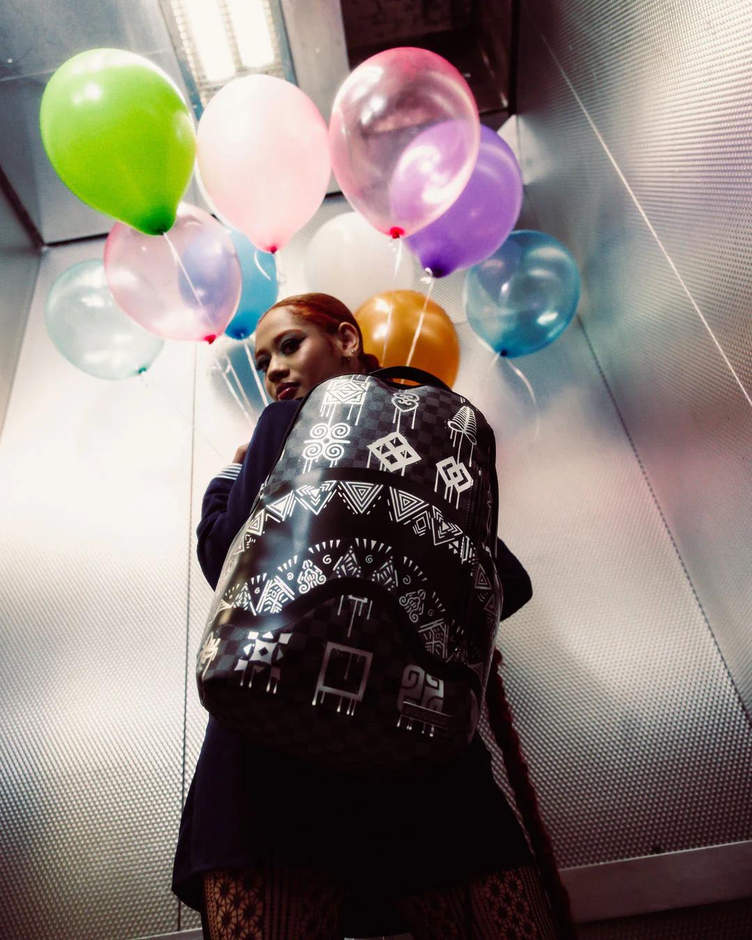 AFRICAN INTELLIGENCE 9 POWER GLYPHICS BACKPACK - SANDFLOWER COLLAB | Sprayground New
