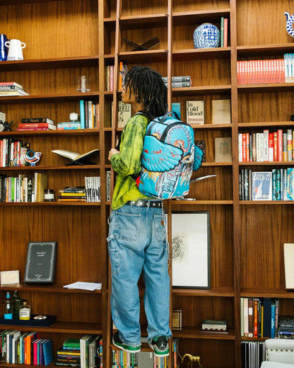 OFFICIAL BASQUIAT UNTITLED (FALLEN ANGEL) 1981 WING BACKPACK (DLXV) | Sprayground Best Seller