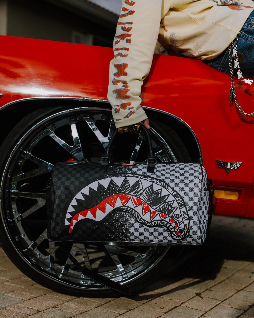 SCRIBBLE DRIBBLE CHECK DUFFLE | Sprayground Trending