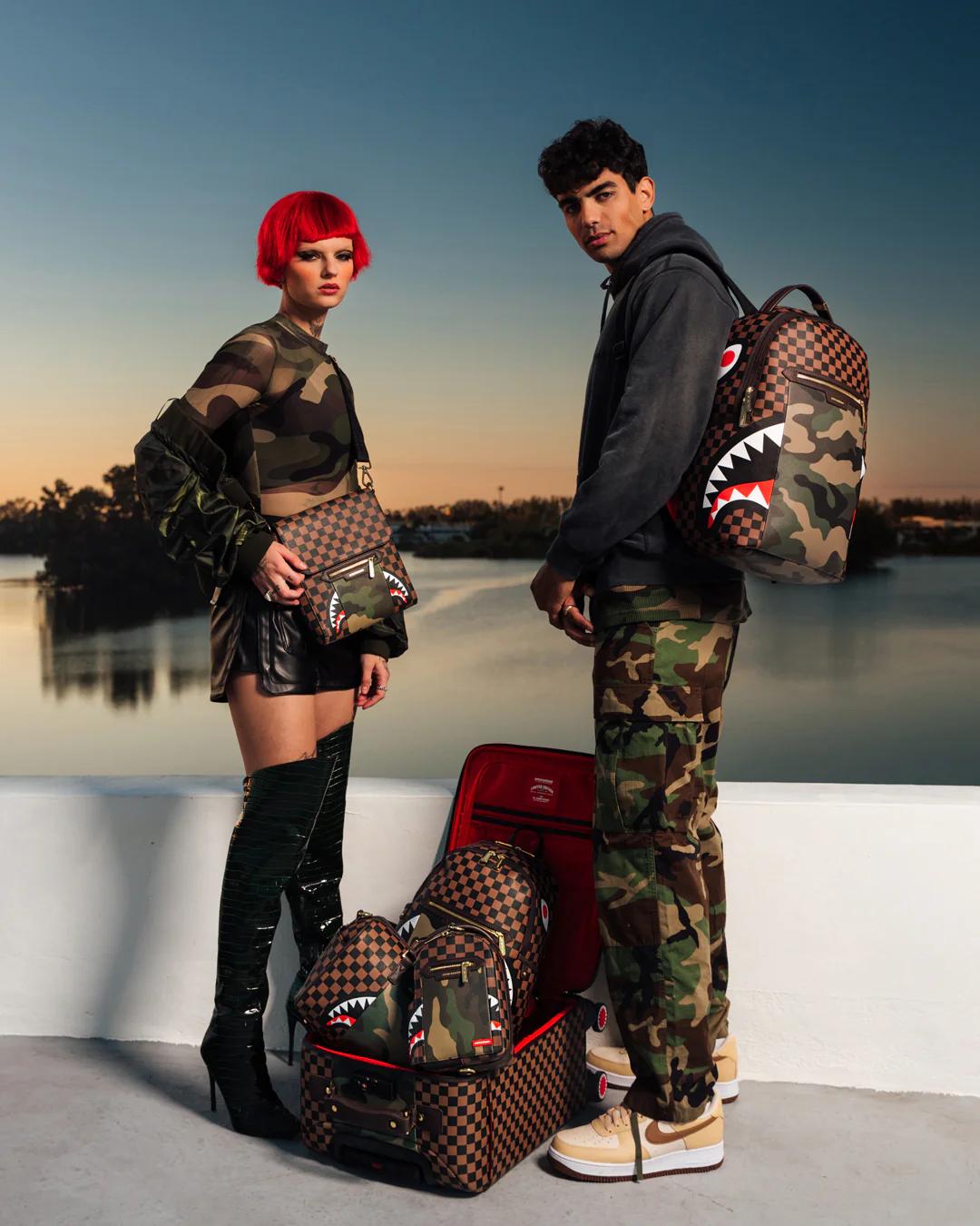 EXTERIOR GOLD ZIP POCKET SHARKS IN PARIS JETSETTER CARRY-ON LUGGAGE | Sprayground Trending