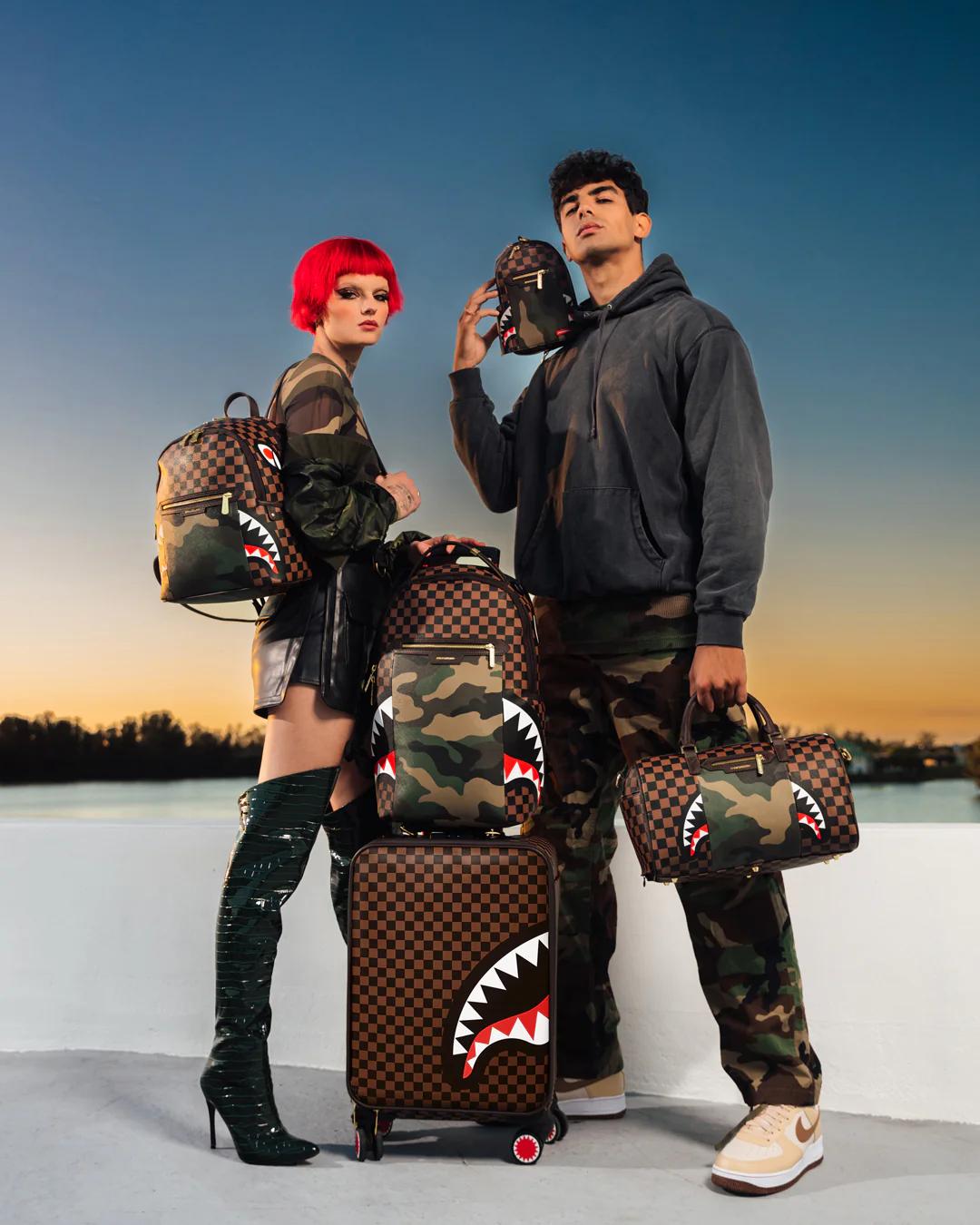 EXTERIOR GOLD ZIP POCKET SHARKS IN PARIS JETSETTER CARRY-ON LUGGAGE | Sprayground Trending
