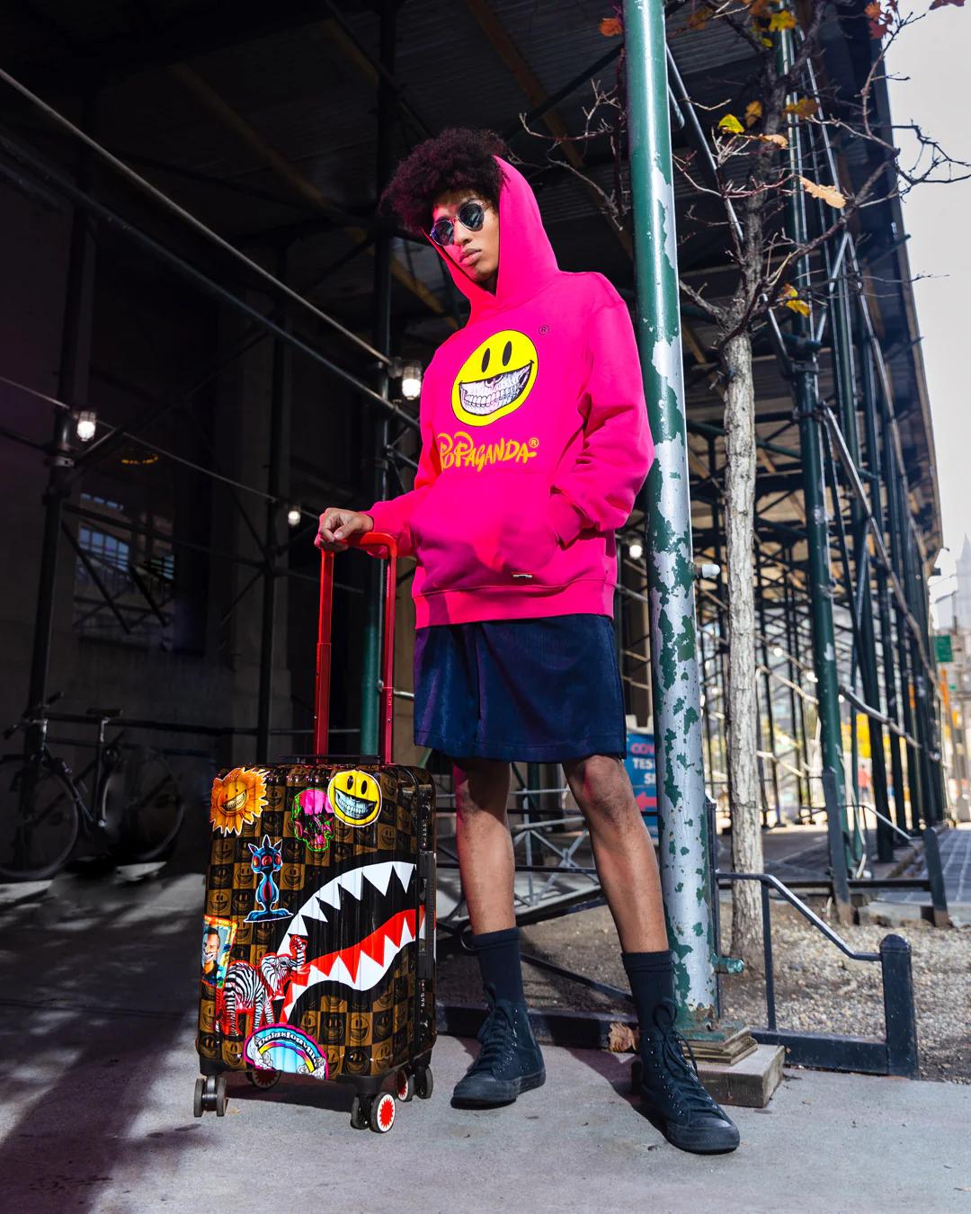 GLOBAL MOGUL POPAGANDA RON ENGLISH EDITION HARDSHELL CARRY-ON LUGGAGE | Sprayground Latest