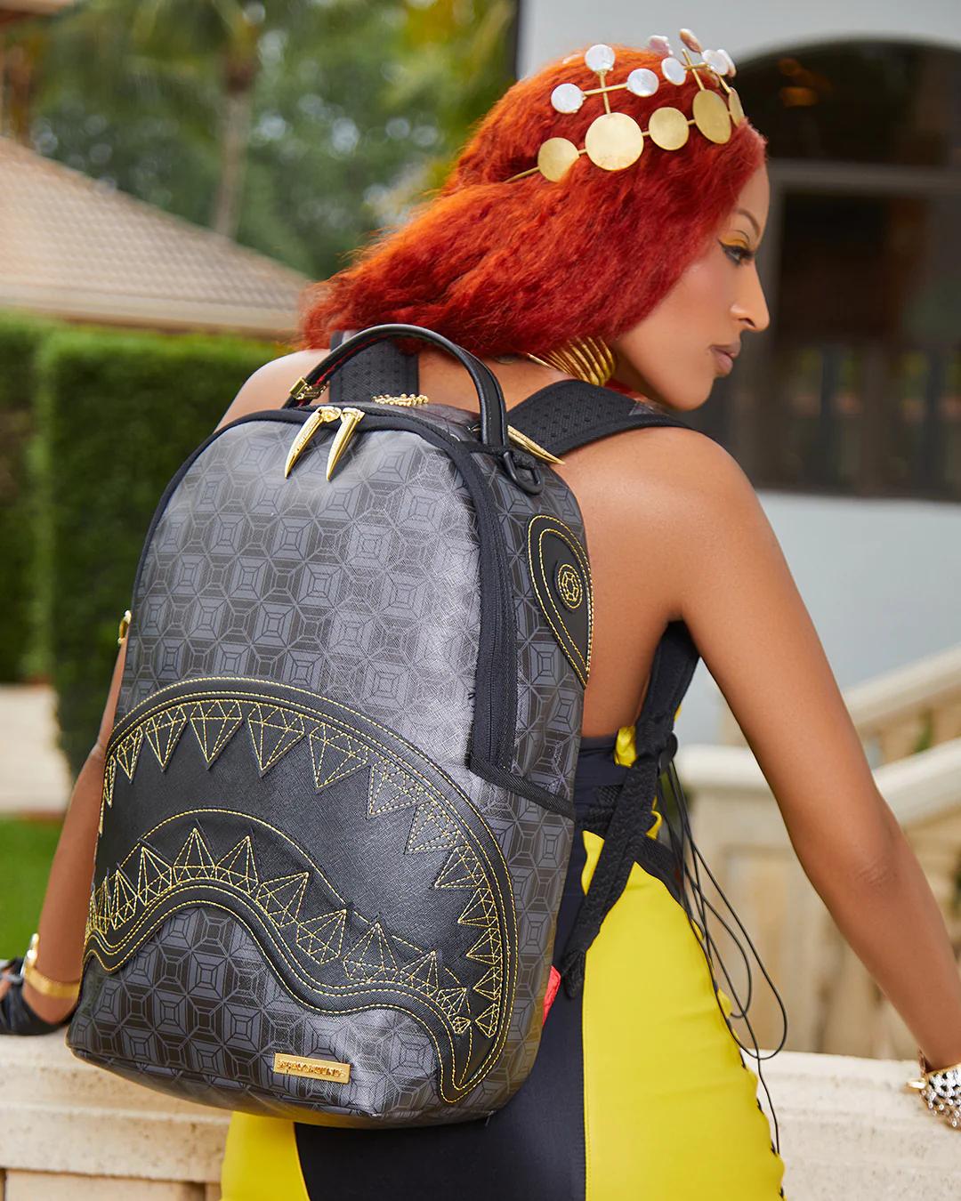 OBSIDIAN STUNNER A.i.6 SANDFLOWER COLLAB BACKPACK (DLXV) | Sprayground Best Seller