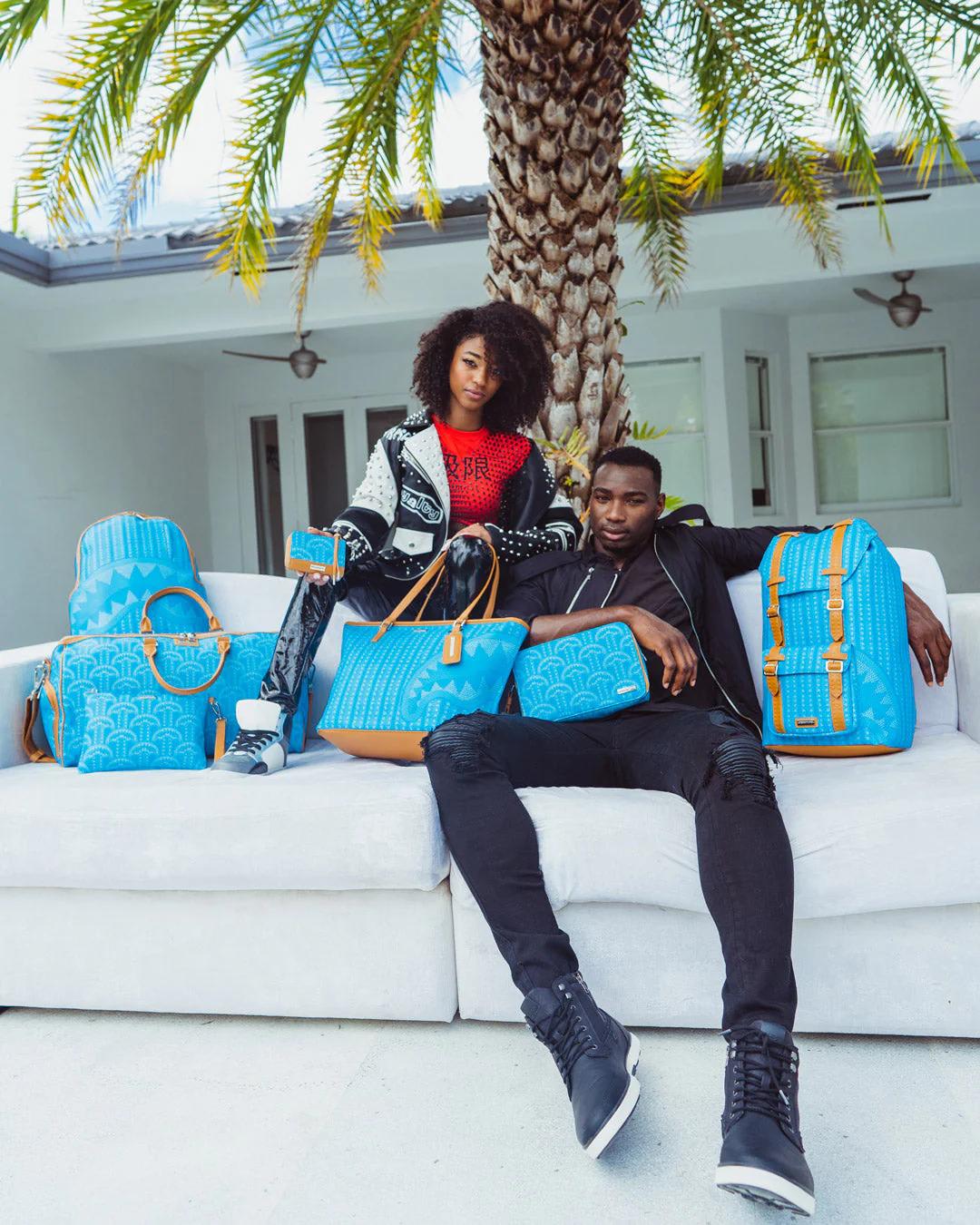 ILLUCHAINS TURQ CROSSOVER CLUTCH | Sprayground Everyday