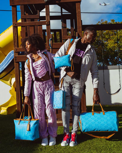 ILLUCHAINS TURQ CROSSOVER CLUTCH | Sprayground Everyday