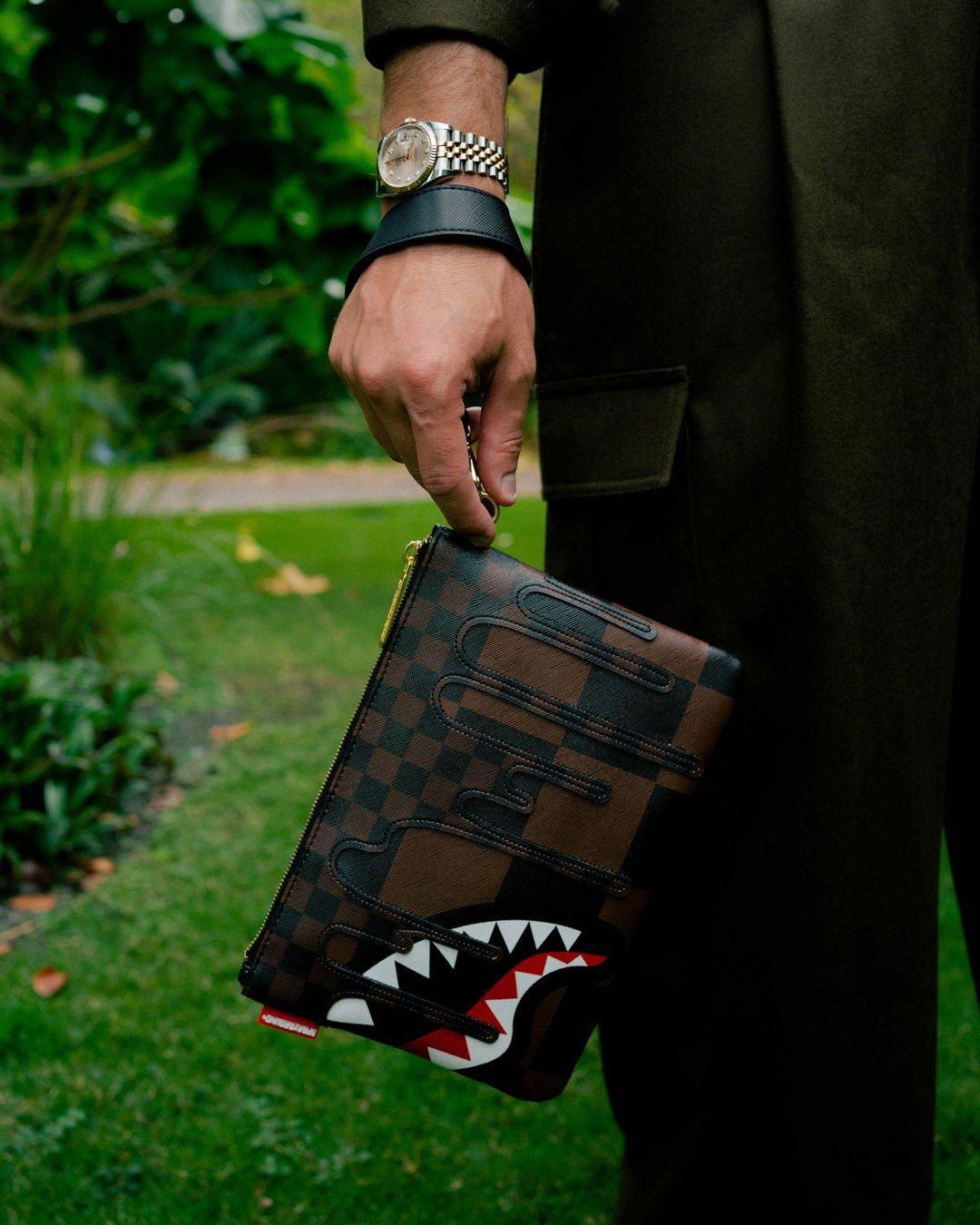 XTC SHARKS IN PARIS CROSSOVER CLUTCH | Sprayground Essential