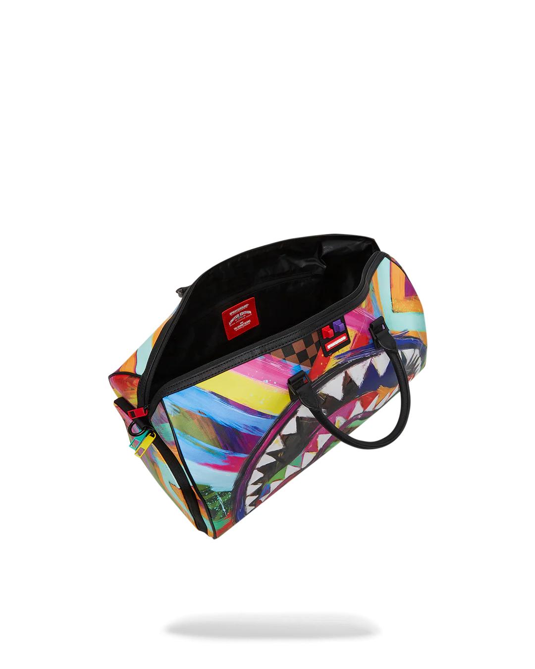 SHARKS IN PARIS CITY STREAKS DUFFLE | Sprayground Signature