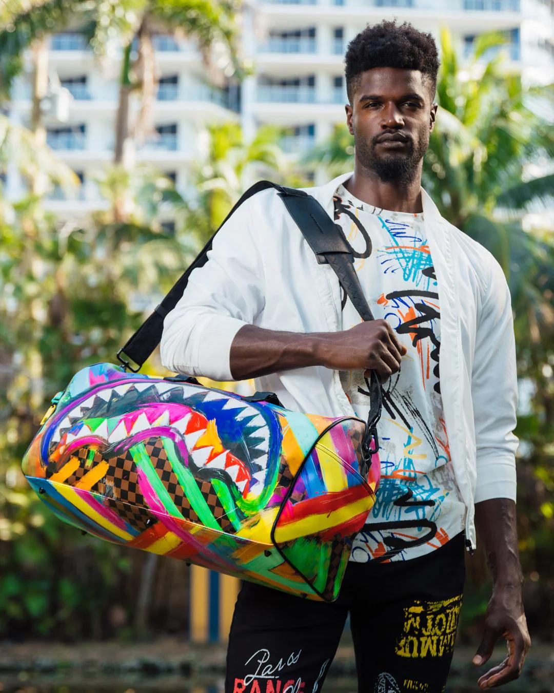 SHARKS IN PARIS CITY STREAKS DUFFLE | Sprayground Signature
