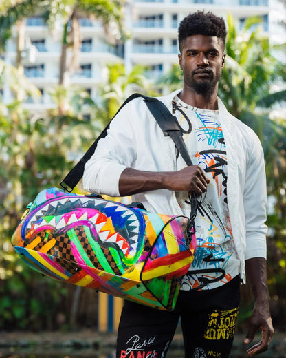 SHARKS IN PARIS CITY STREAKS DUFFLE | Sprayground Signature