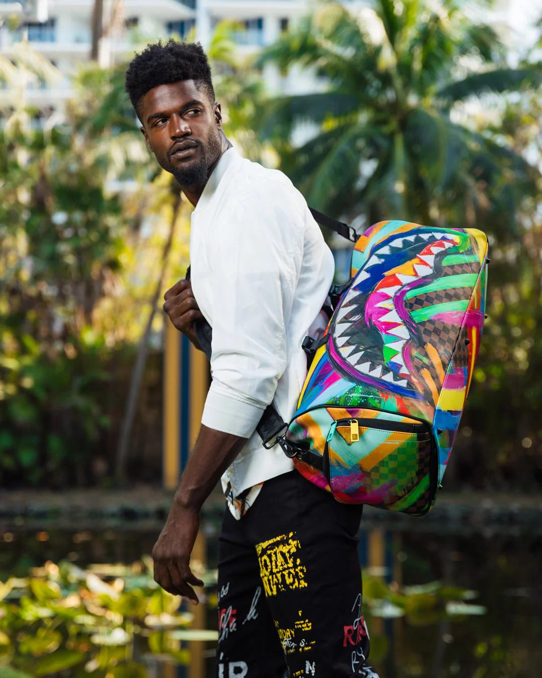 SHARKS IN PARIS CITY STREAKS DUFFLE | Sprayground Signature