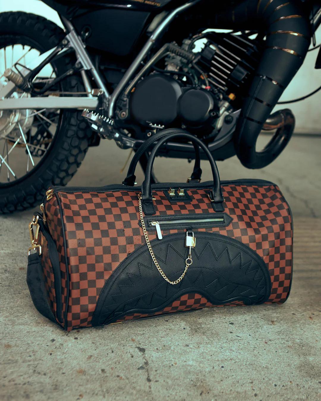 HENNY LOCK SHARKS IN PARIS DUFFLE | Sprayground Trending
