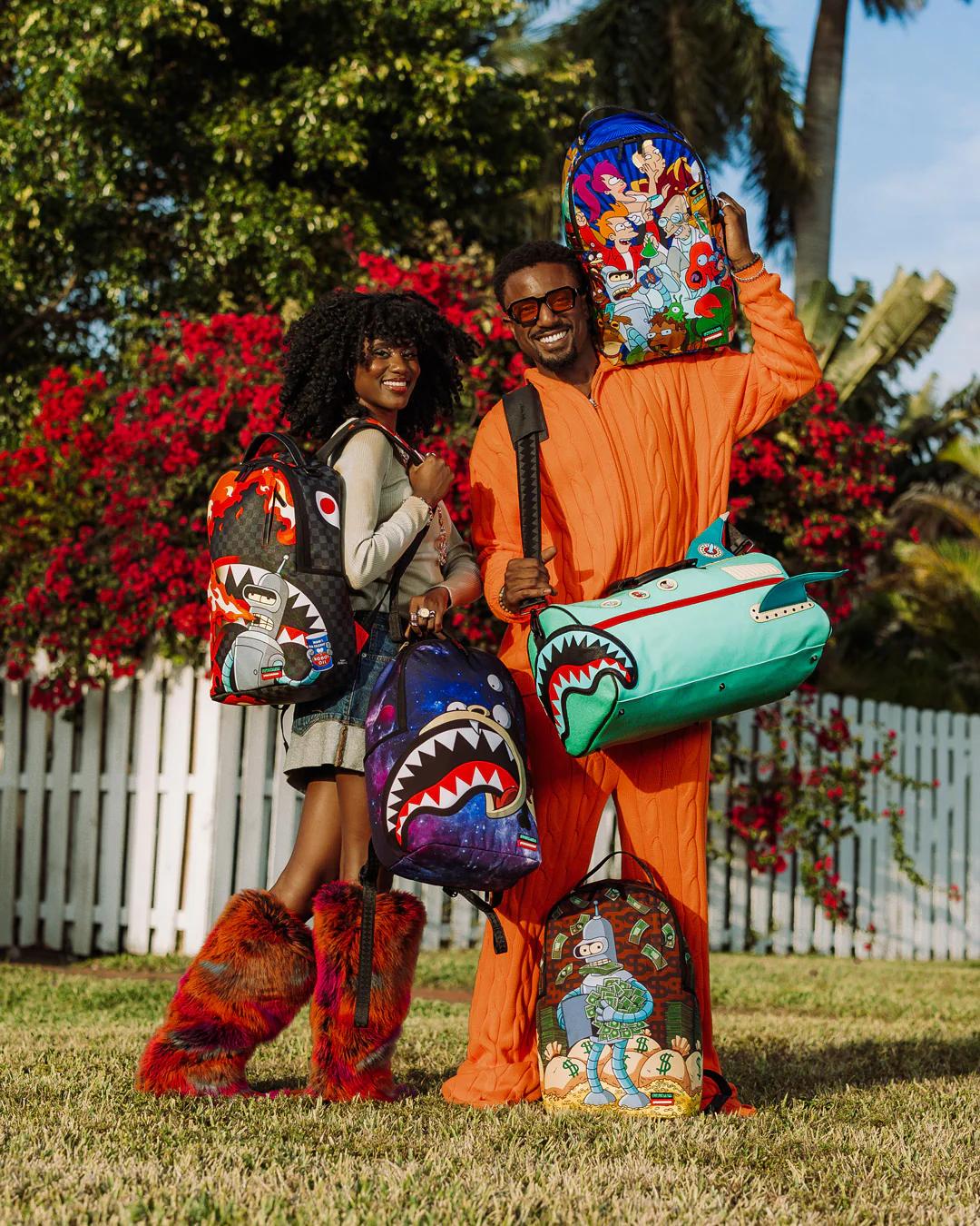 FUTURAMA NIBBLER EAT SHARK DLXR BACKPACK | Sprayground Featured