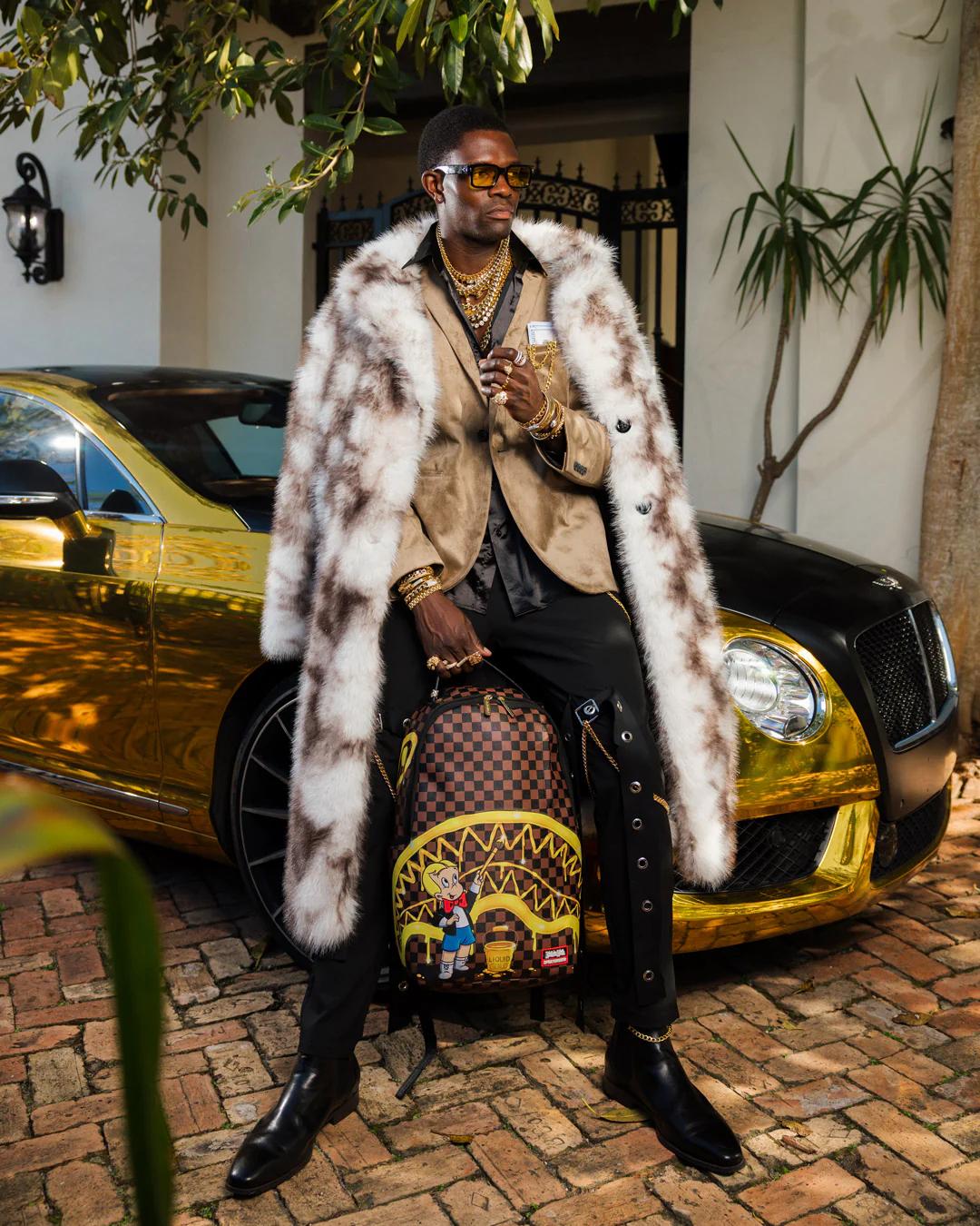 RICHIE RICH PAINT THE SHARK GOLD BACKPACK | Sprayground Best Seller