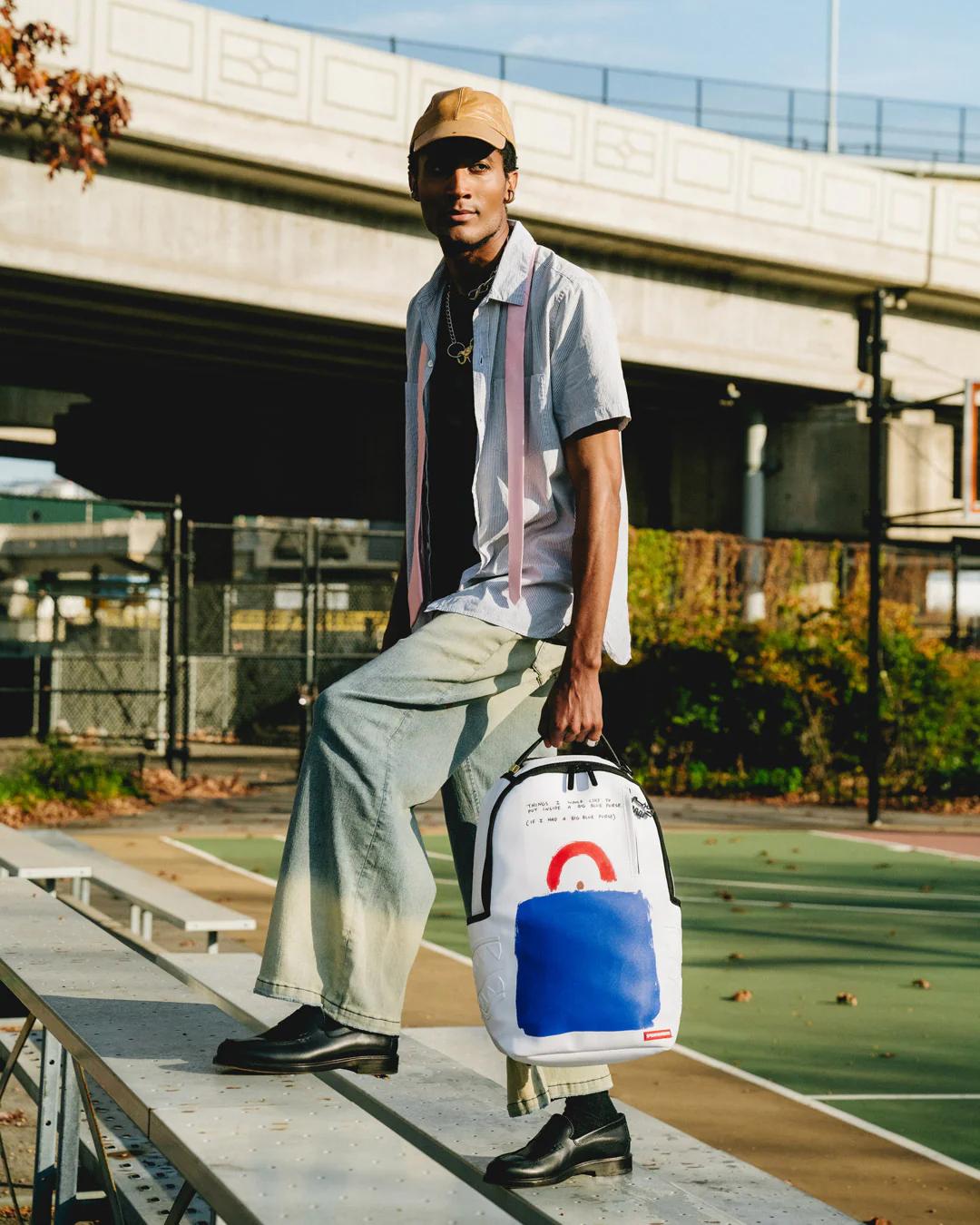 KEITH HARING BIG BLUE PURSE ART BACKPACK | Sprayground Exclusive