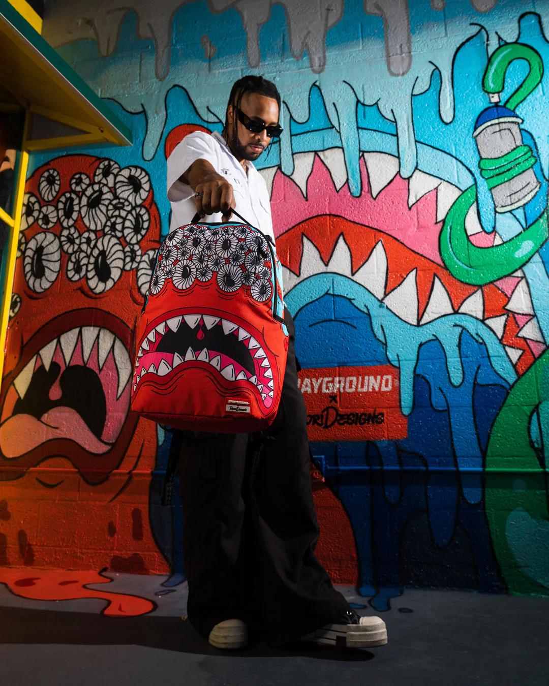 JORGE RODRIGUEZ THE ARTIST COLLAB BLINKY SHARK BACKPACK | Sprayground Best Seller
