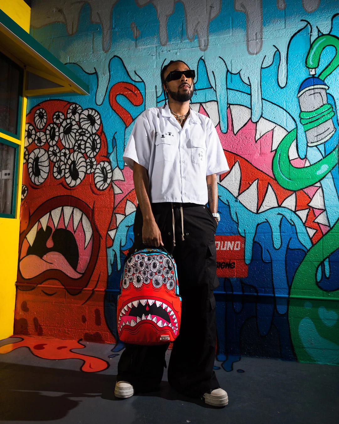 JORGE RODRIGUEZ THE ARTIST COLLAB BLINKY SHARK BACKPACK | Sprayground Best Seller
